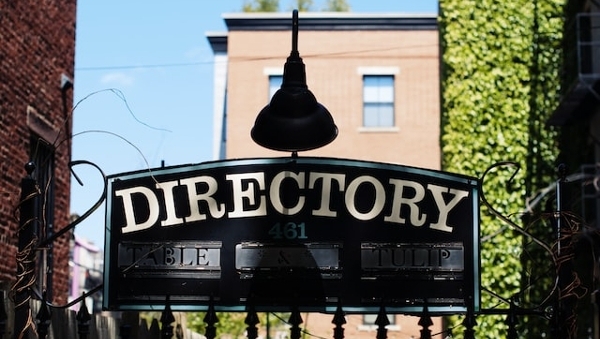 A gate with a Directory sign